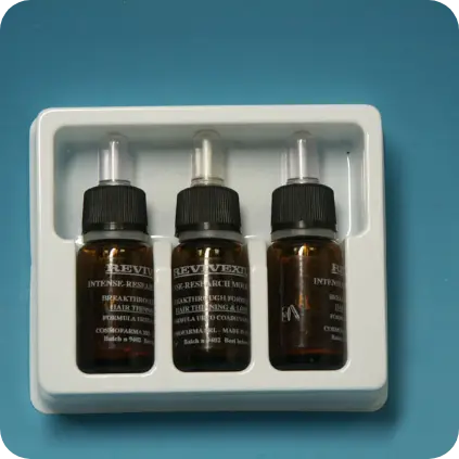 Blister termoformato su misura per tre flaconi cosmetici – Produzione packaging in plastica Seriplast